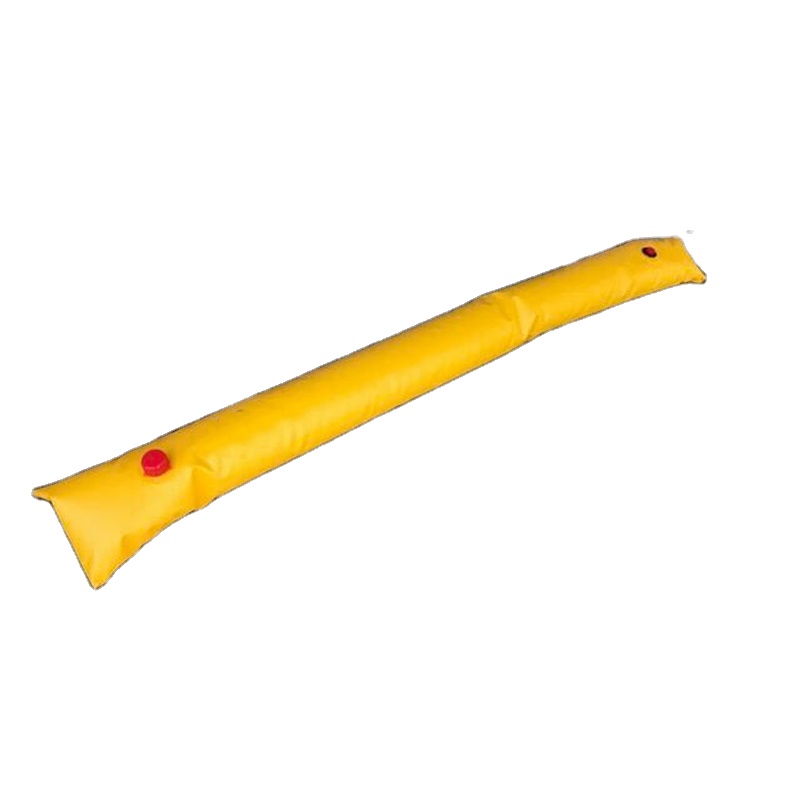 Yellow water-filled flood barrier with red filling caps