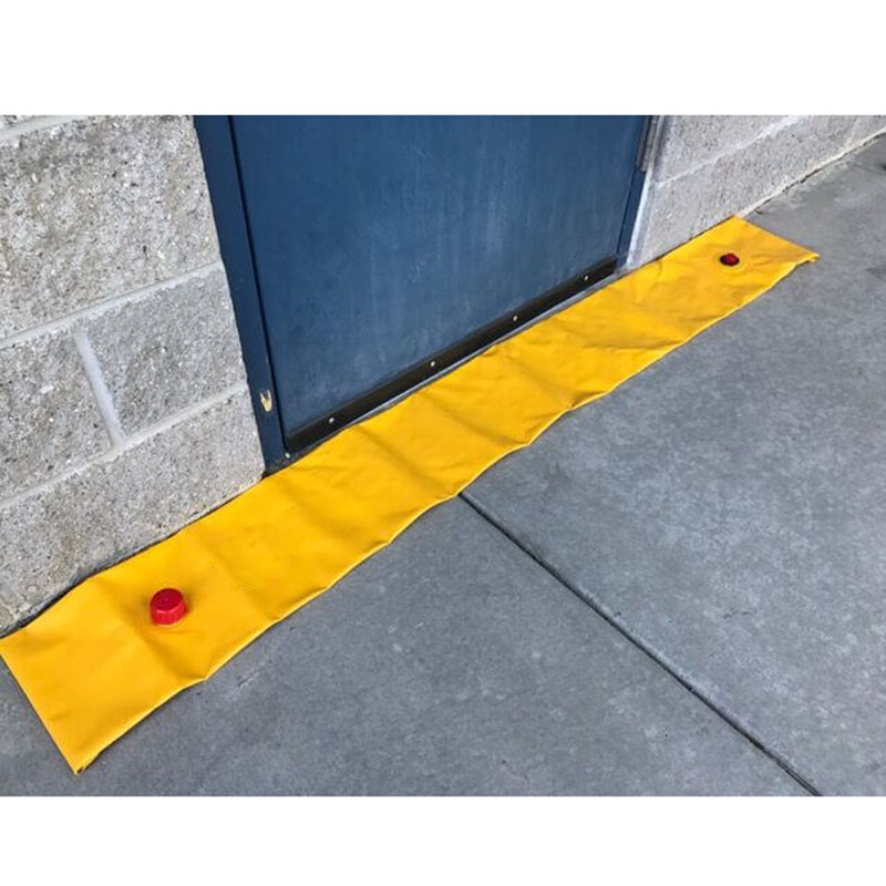 Empty yellow flood barrier laid across a doorway
