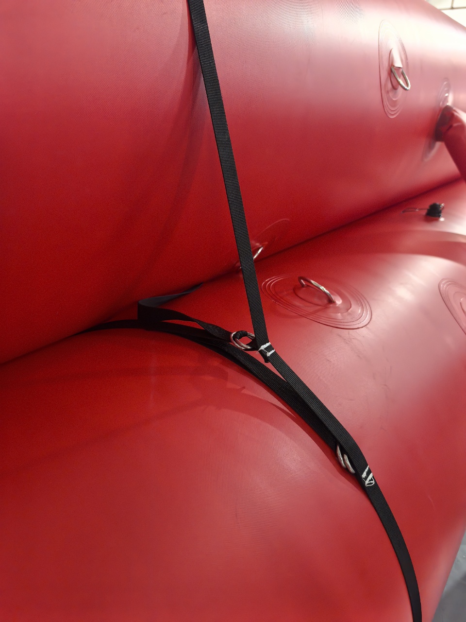 Close-up of securing straps and D-ring connection points between FloodLine XL tubes
