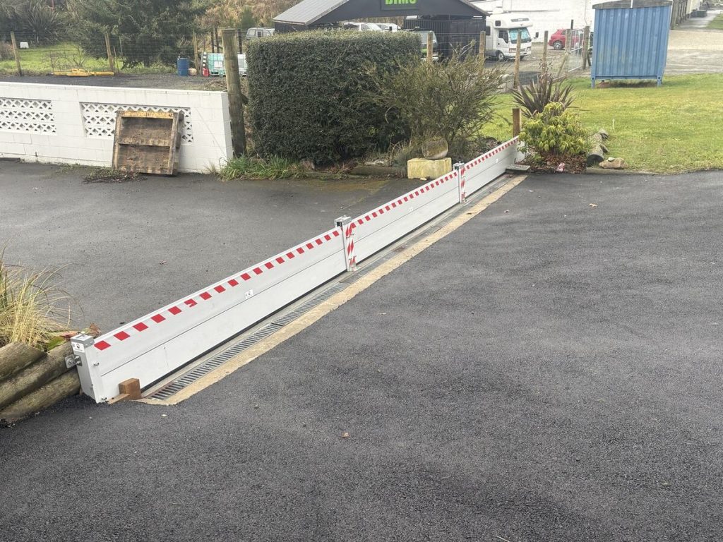 Angled view of FloodShield aluminium panels and intermediate posts installed at a South Island property